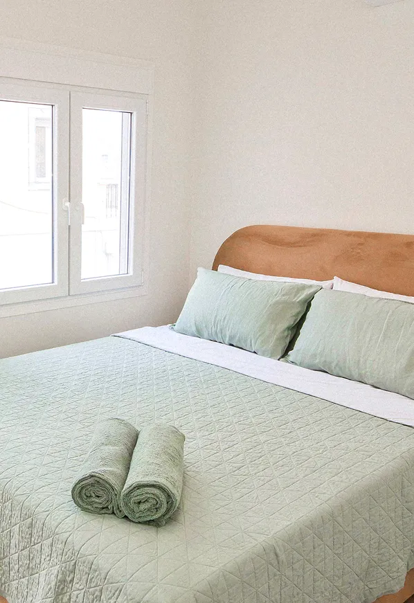 A light-filled bedroom waking to the morning at Villa St. George