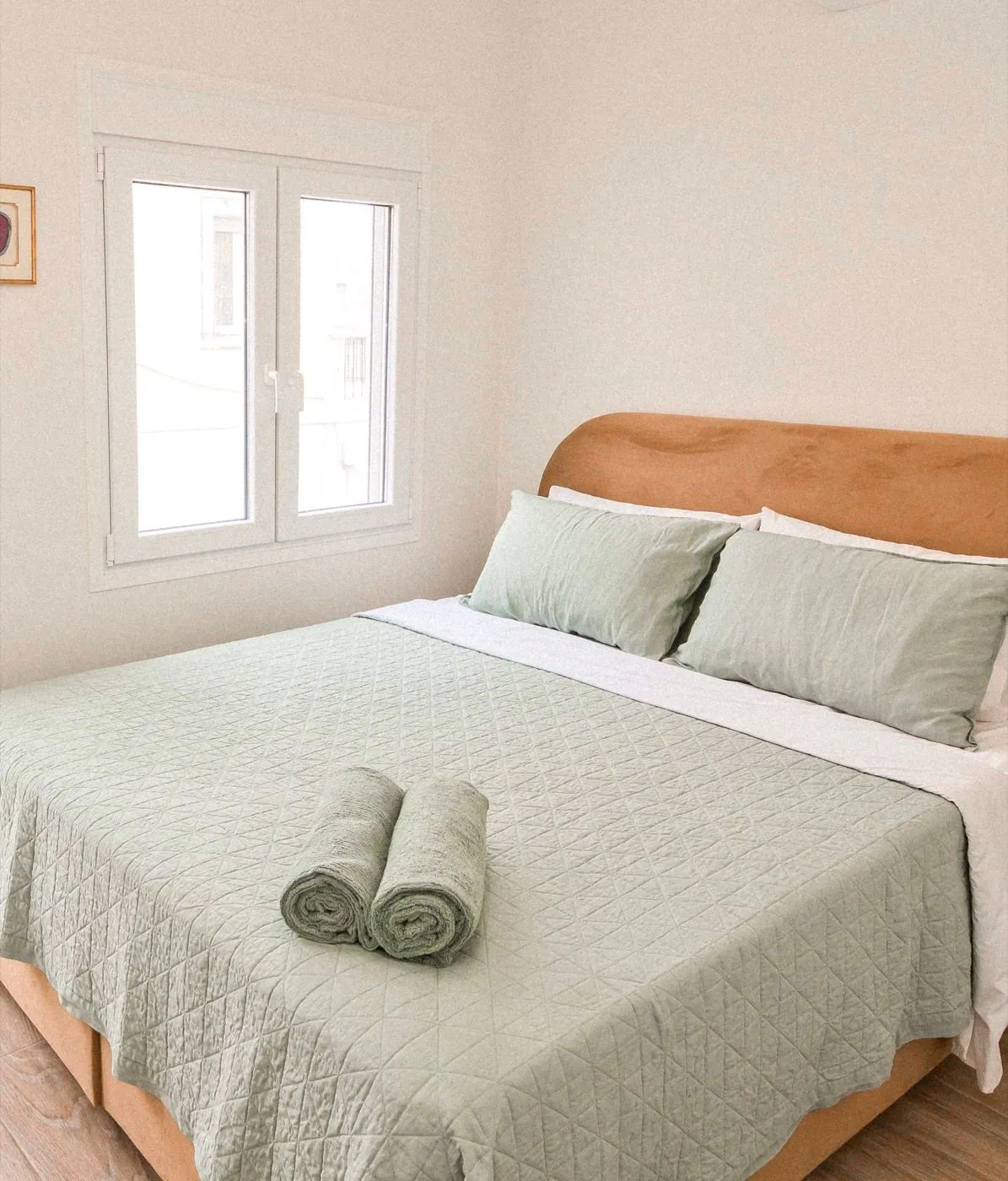 A light-filled bedroom waking to the morning at Villa St. George